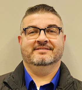 Staff member Andrew Miller from ID_b77c5c2ce69a